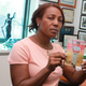 Maribel Martinez holding photo of her son Andy Martinez Mercado
Jesse Ward/New York Daily News screenshot